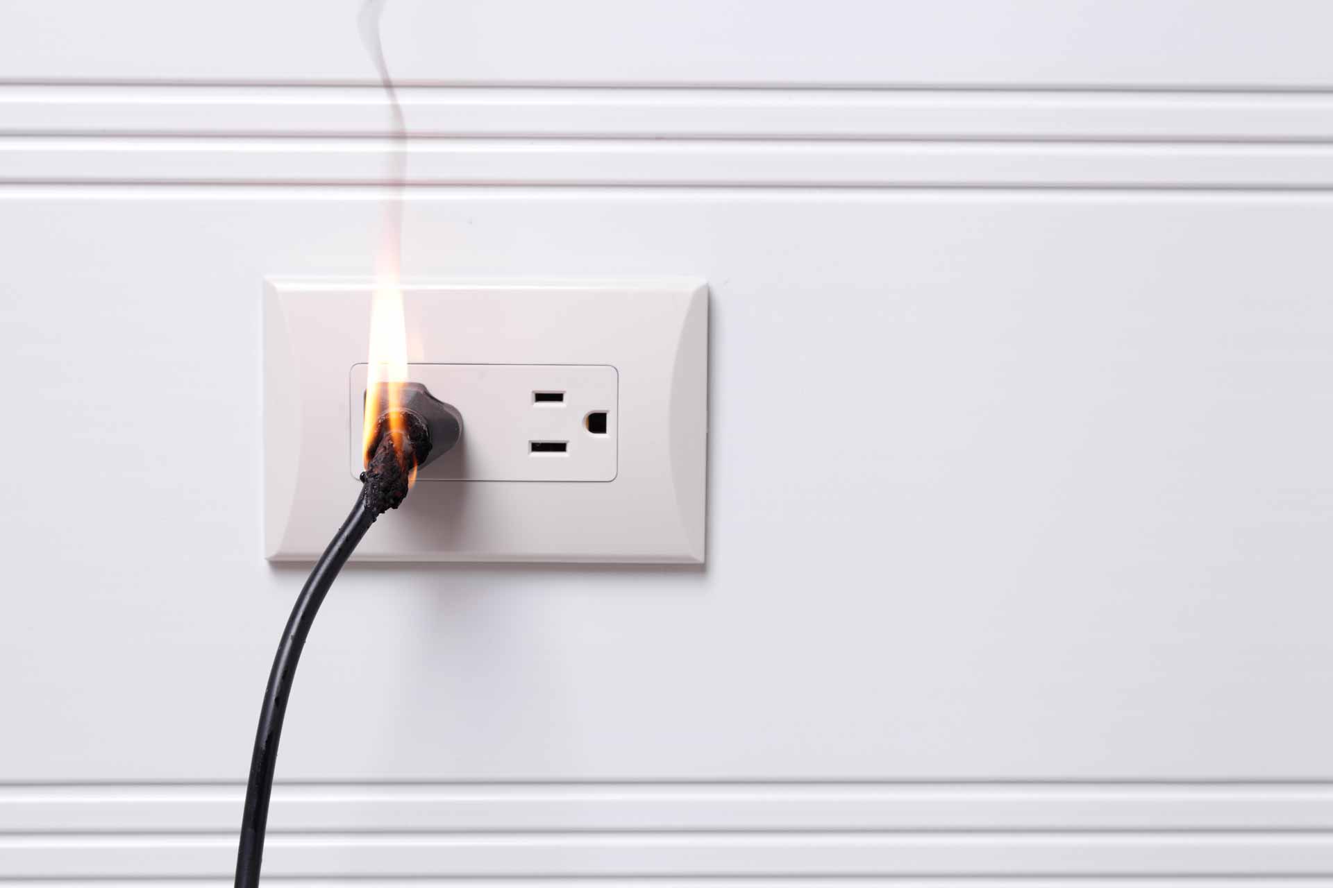 Electrical outlet on fire